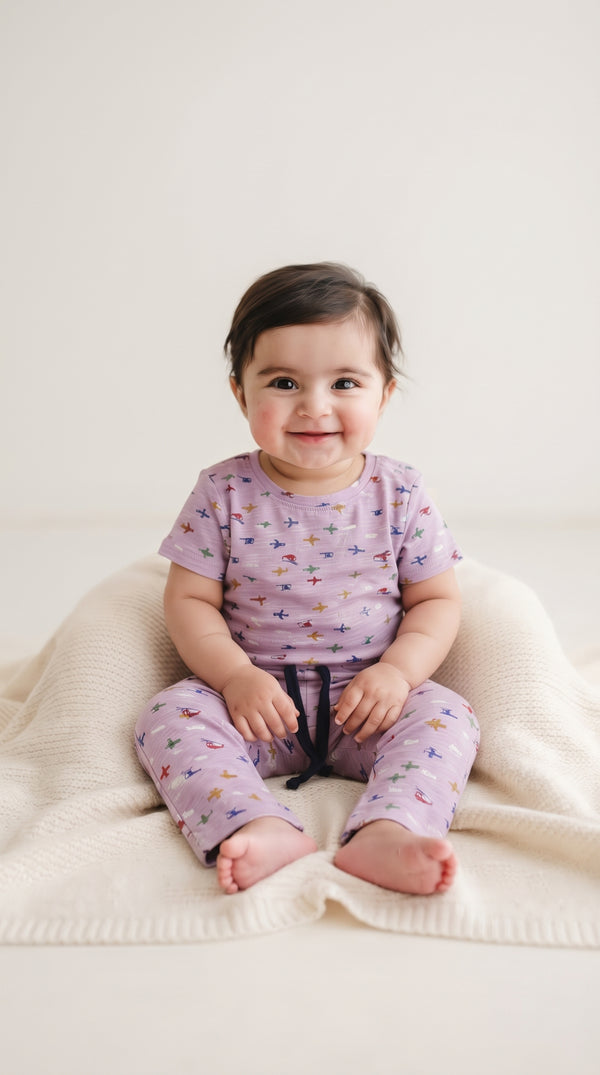 Baby wearing the Kids Lilac Aeroplane T-Shirt and Pants Set
