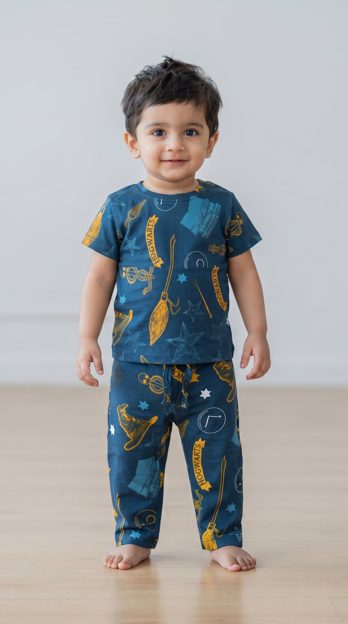 Baby wearing the Teal Wizard Print T-Shirt and Pants Set