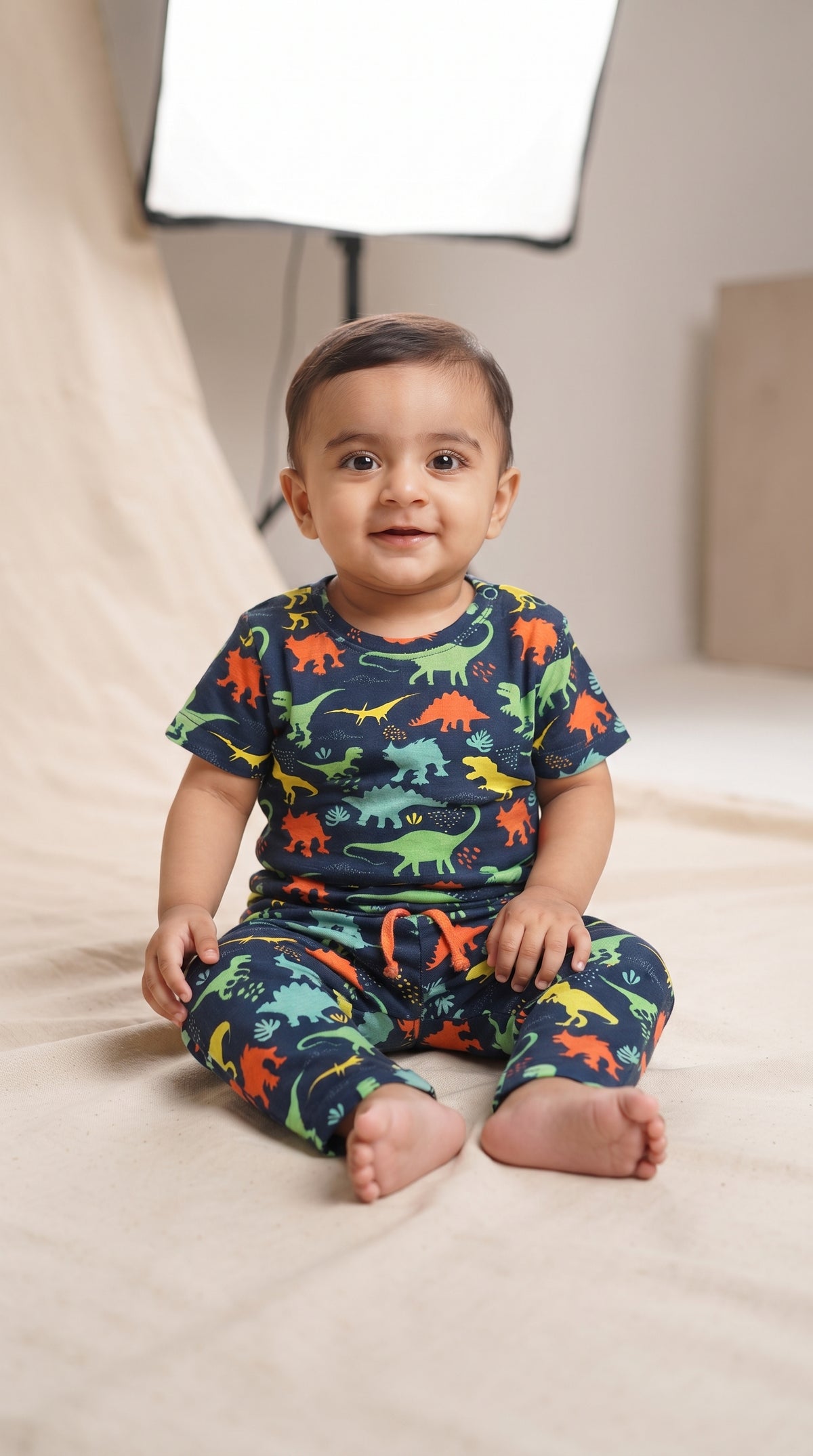 Baby wearing the Navy Dinosaur T-Shirt and Pants Set