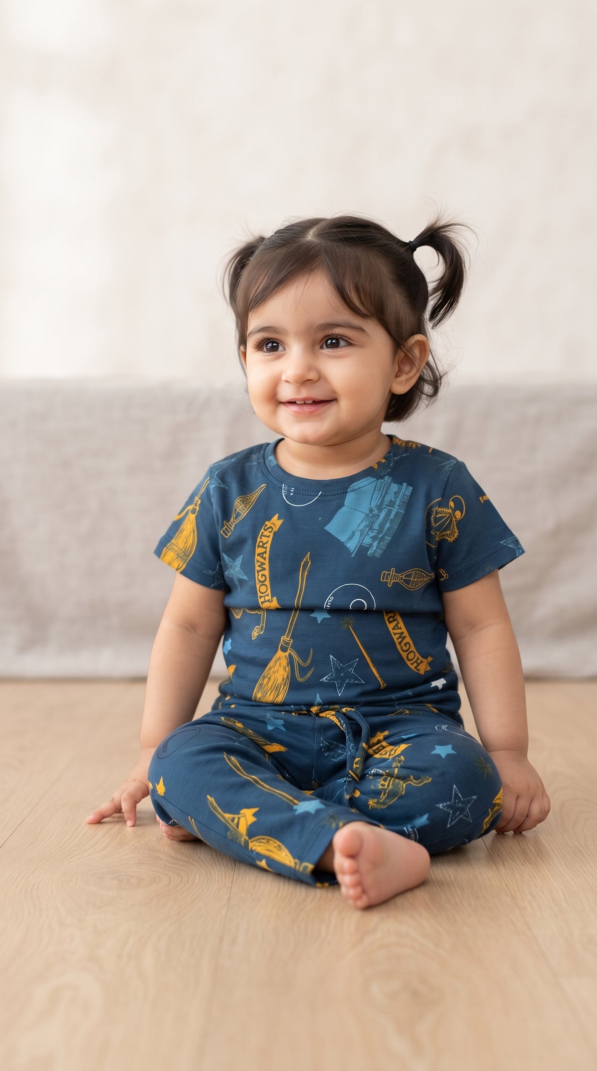 Baby wearing the Teal Wizard Print T-Shirt and Pants Set
