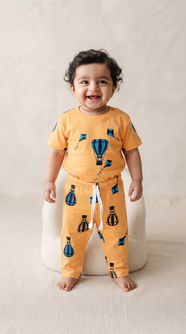 Baby wearing the Orange Hot Air Balloon and Kites T-Shirt and Pants Set