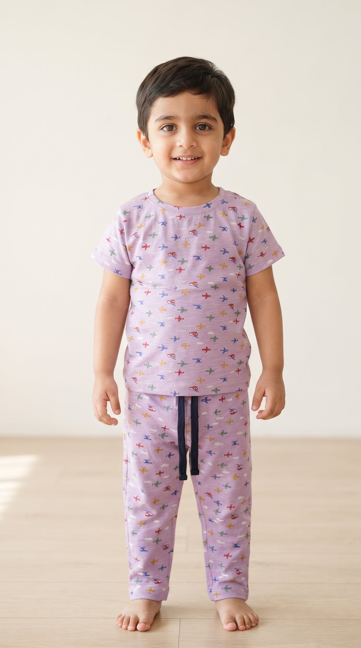 Baby wearing the Kids Lilac Aeroplane T-Shirt and Pants Set