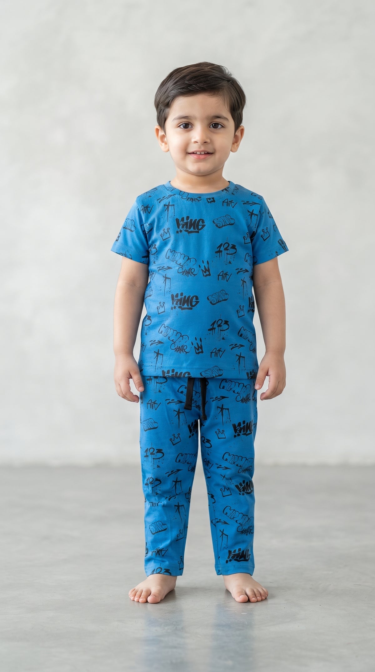 Baby wearing the Kids Blue Graffiti King T-Shirt and Pants Set