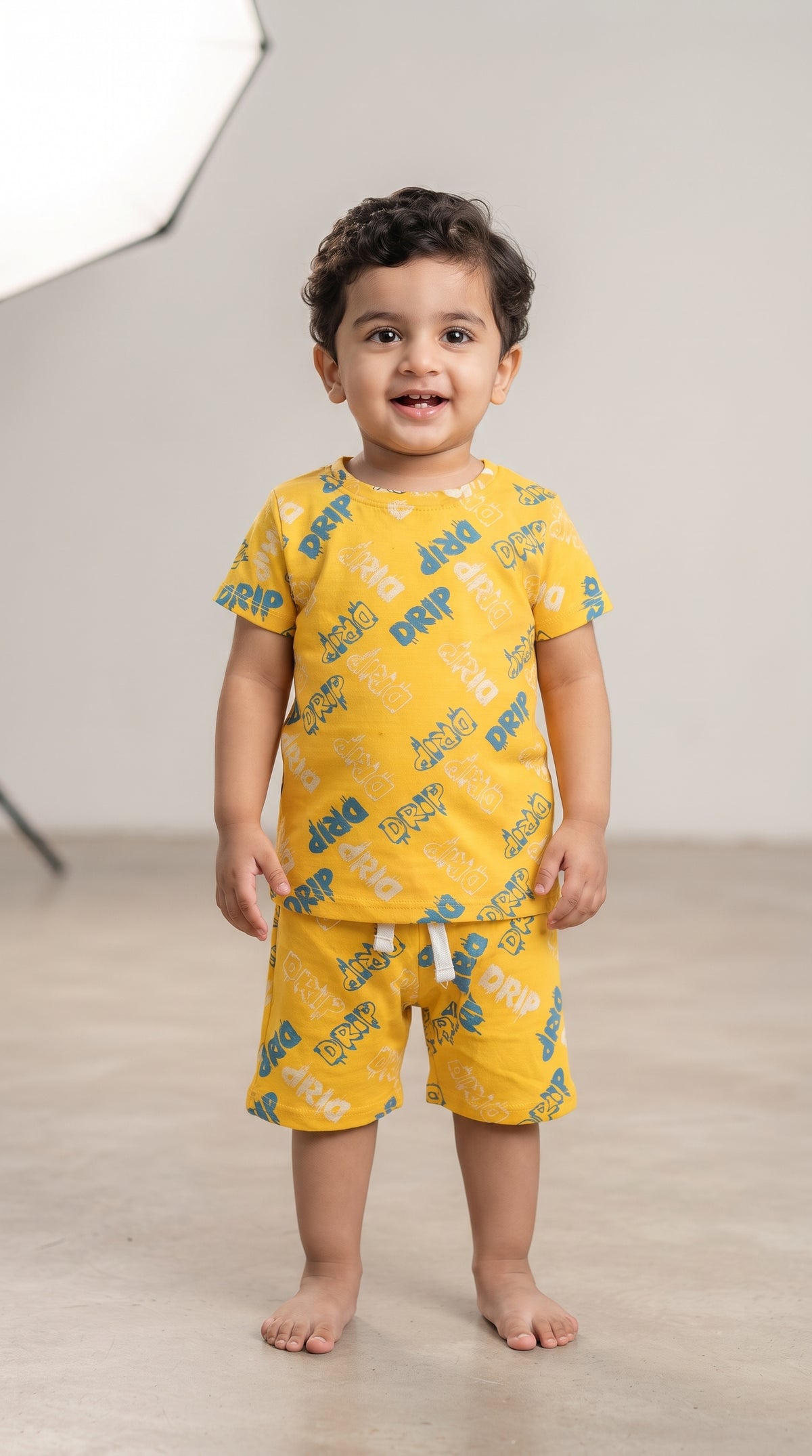 Baby wearing the Yellow Drip Graffiti T-Shirt and Shorts Set